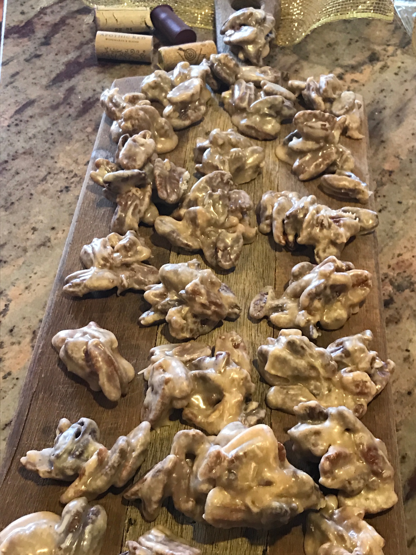 Homemade almond praline clusters on a wooden board